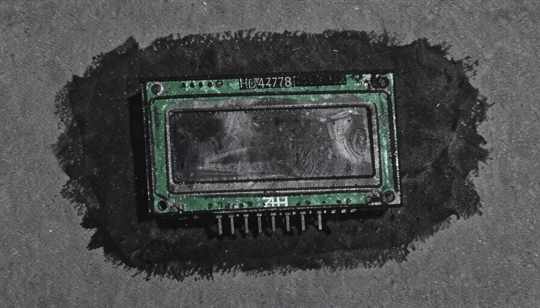 A bold charcoal drawing of an HD44780 character LCD display module with its green PCB and parallel pin header, shown against a dark textured background with soft smudged edges.